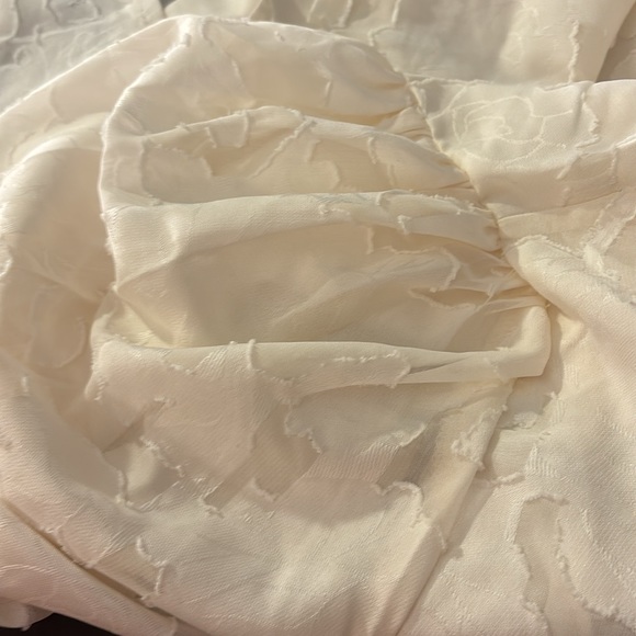 Zulily top in XXL has embossed flowers It’s  lining the sleeve are see-threw - Picture 15 of 15